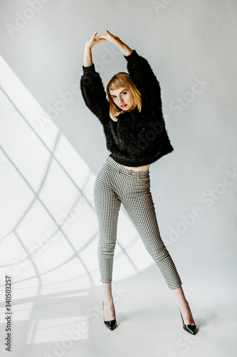 Model posing in a natural light studio