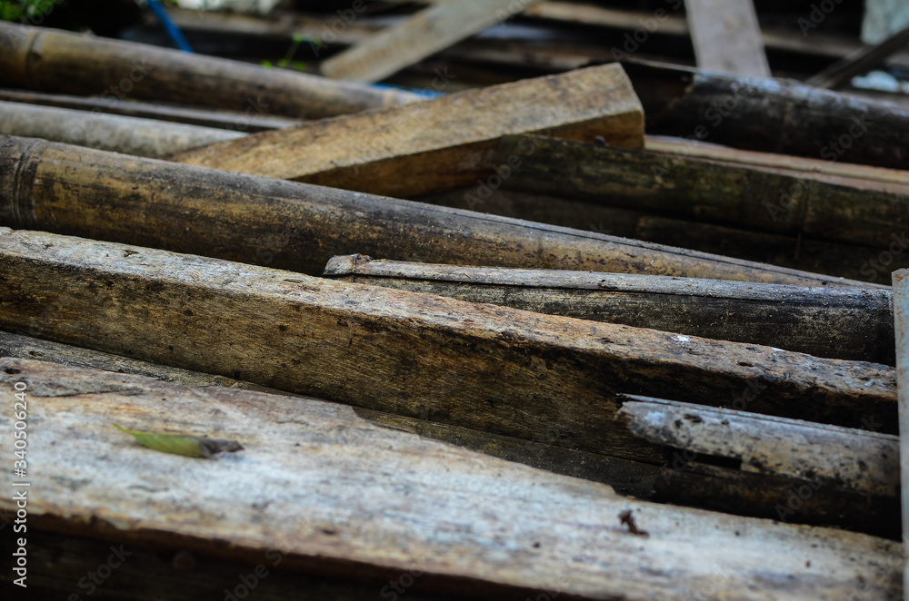 Piles of abandoned weathered wood. Selective focus Piles of abandoned weathered wood. Selective focus