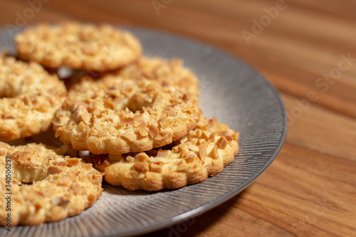 sable biscuits with chopped peanuts on top