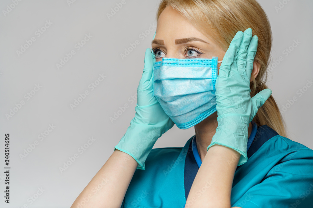 medical doctor nurse woman wearing protective mask and rubber or latex gloves - headache and stress medical doctor nurse woman wearing protective mask and rubber or latex gloves - headache and stress