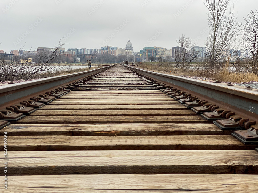city railroad tracks over lake