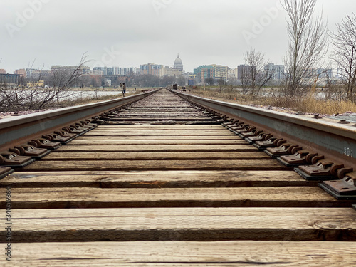 Fototapeta Naklejka Na Ścianę i Meble -  city railroad tracks over lake