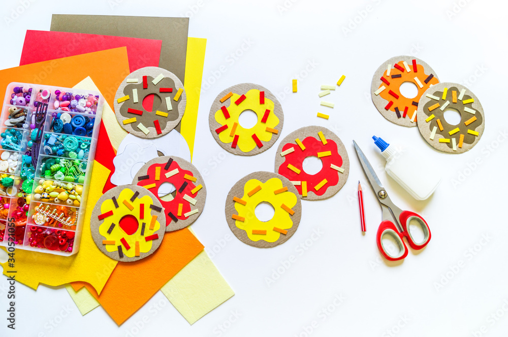Garland of cardboard and paper donuts.