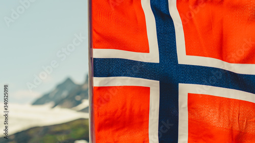 Norwegian flag and mountains snowy landscape