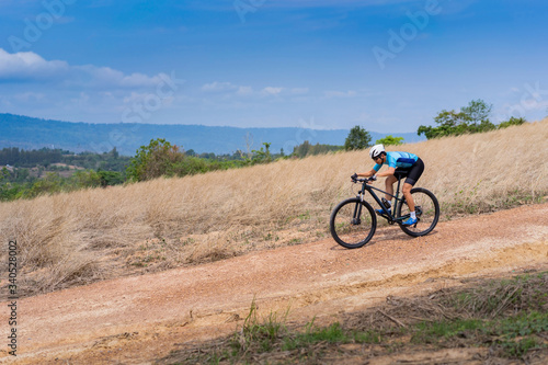 Mountain biker cyclist training practice downhill