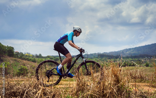 Mountain biker cyclists training Mountain trail © torwaiphoto