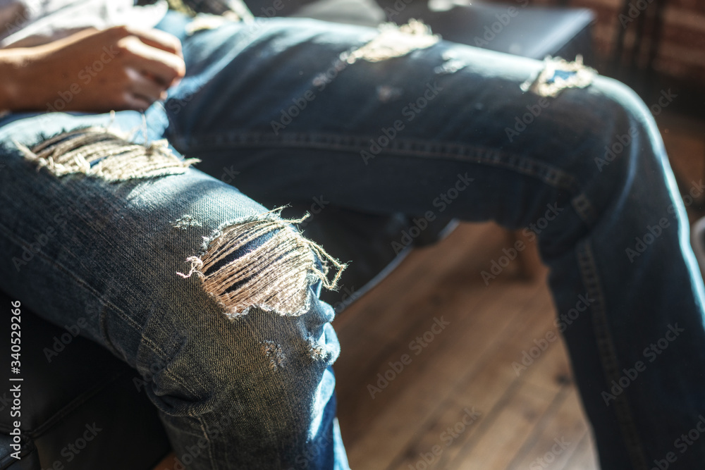 Man wearing a rugged jeans Stock Photo Adobe Stock