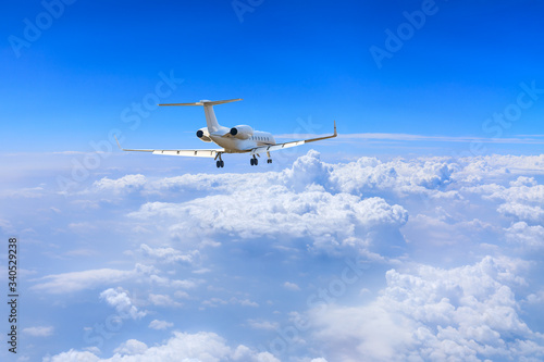 Commercial airplane flying above the clouds,travel concept.