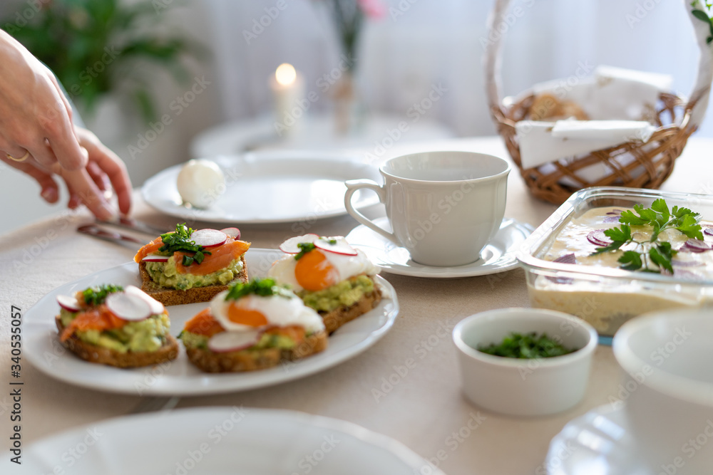Festive Easter table setting with traditional meals. Easter breakfast in Poland. Christian tradition commemorating the resurrection of Jesus. Festive Easter table setting with traditional meals. Easter breakfast in Poland. Christian tradition commemorating the resurrection of Jesus.