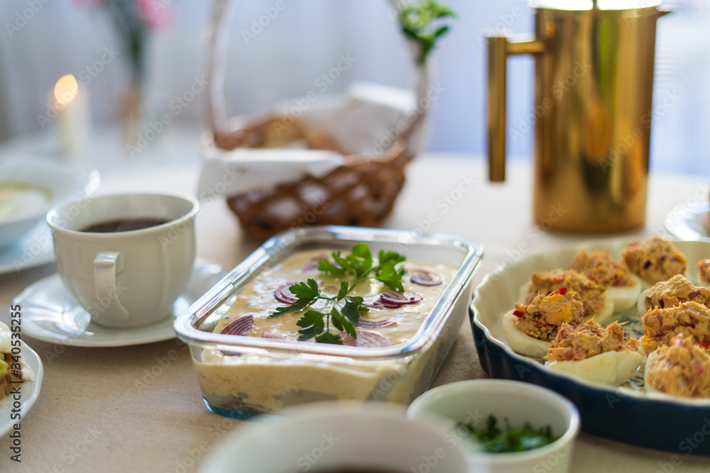 Festive Easter table setting with traditional meals. Easter breakfast in Poland. Christian tradition commemorating the resurrection of Jesus. Festive Easter table setting with traditional meals. Easter breakfast in Poland. Christian tradition commemorating the resurrection of Jesus.