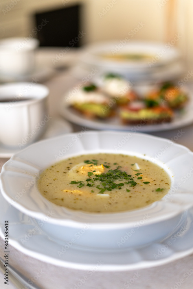 Festive Easter table setting with traditional meals. Easter breakfast in Poland. Christian tradition commemorating the resurrection of Jesus. Festive Easter table setting with traditional meals. Easter breakfast in Poland. Christian tradition commemorating the resurrection of Jesus.