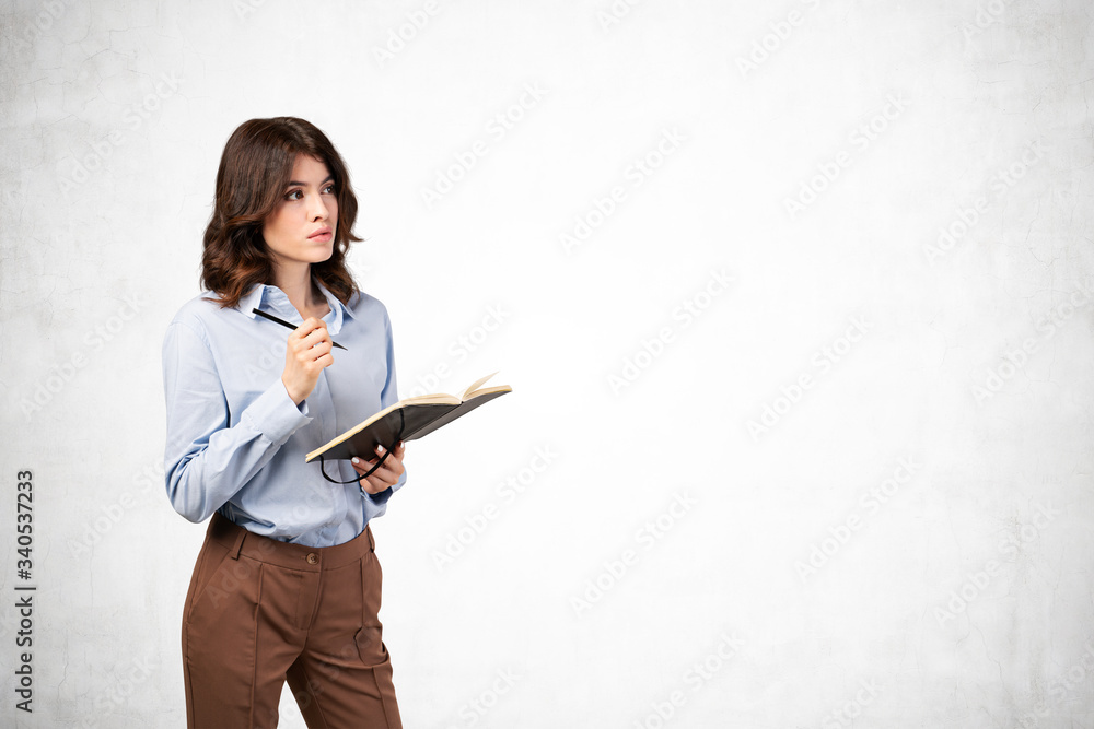 Thoughtful businesswoman with notebook, mock up Thoughtful businesswoman with notebook, mock up