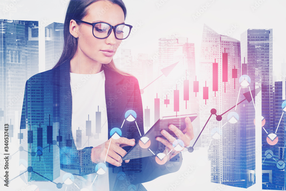 Woman with tablet in city, financial graph