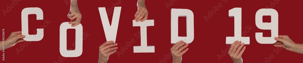 Hands of People hold Covid 19 word Hands of People hold Covid 19 word