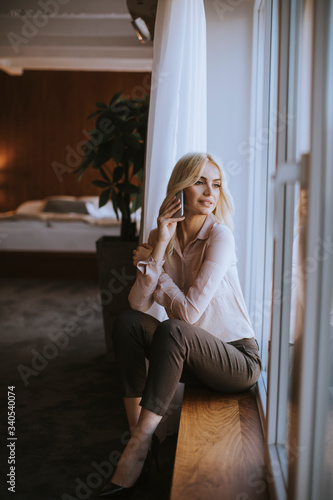 Pretty young blonde woman w...