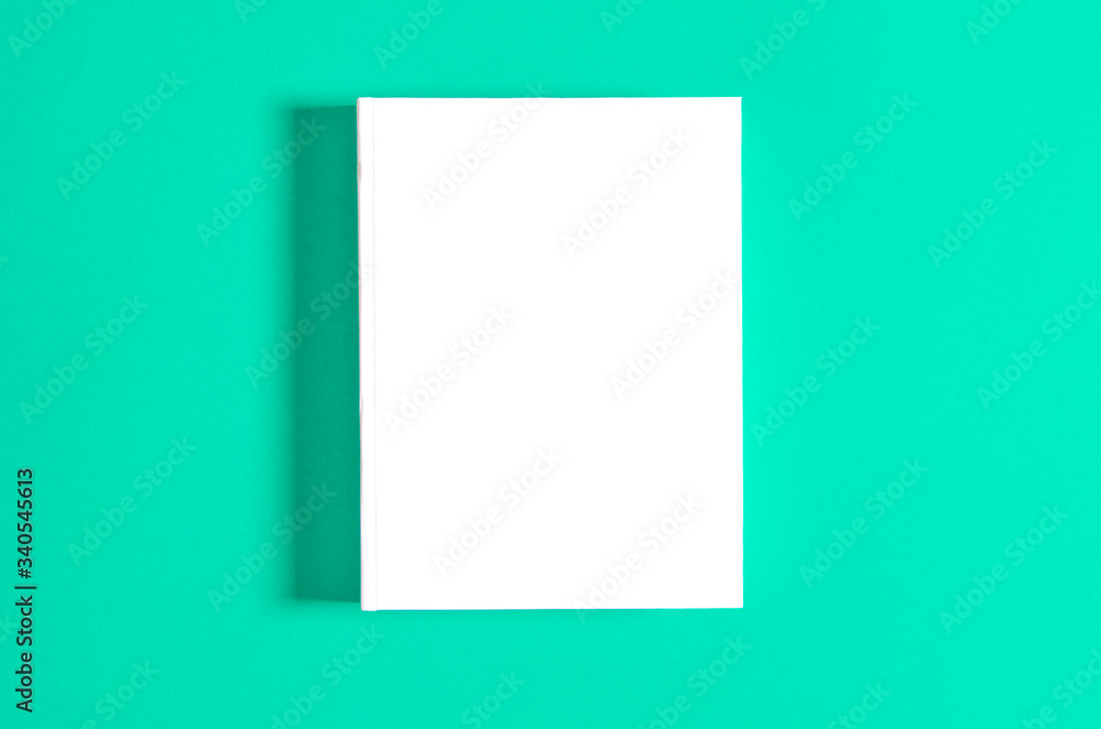 Mockup of closed blank square book at white textured paper Mockup of closed blank square book at white textured paper