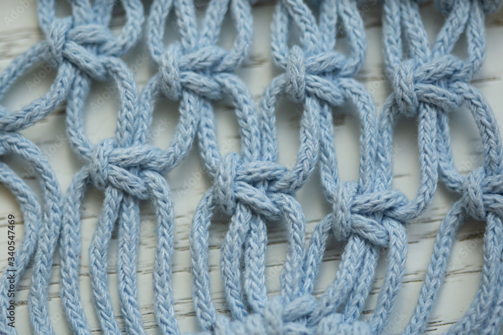 Blue rope with knots close up