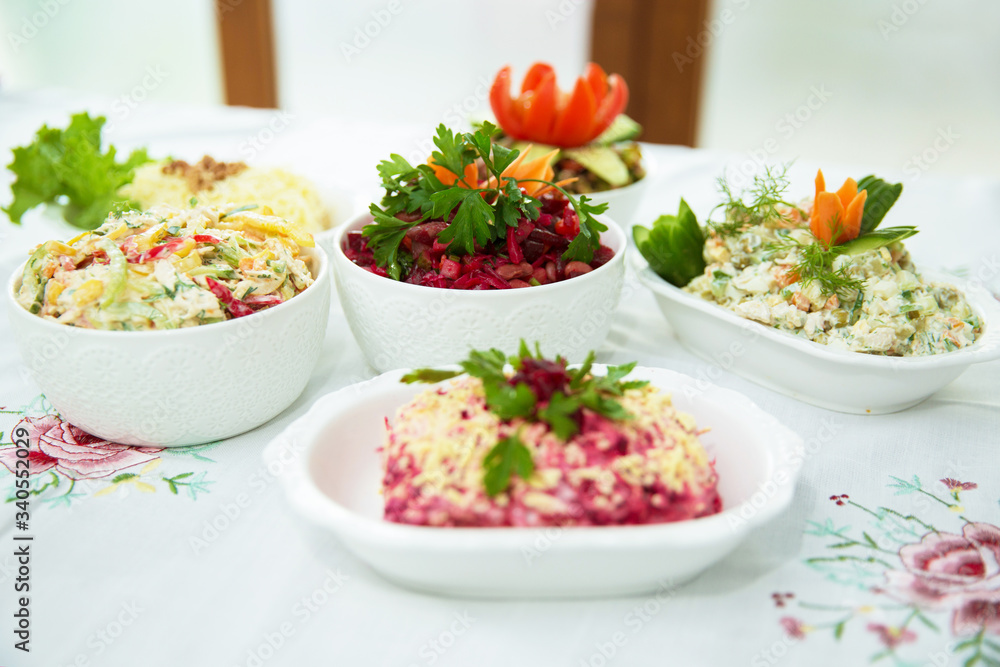 Diet salad with beets . Capital salad . Potato salad . coleslaw salad . set with different salads . Salad ham, orange pepper, mushrooms, pickles, white sauce, on a white bowl. Diet salad with beets . Capital salad . Potato salad . coleslaw salad . set with different salads . Salad ham, orange pepper, mushrooms, pickles, white sauce, on a white bowl.