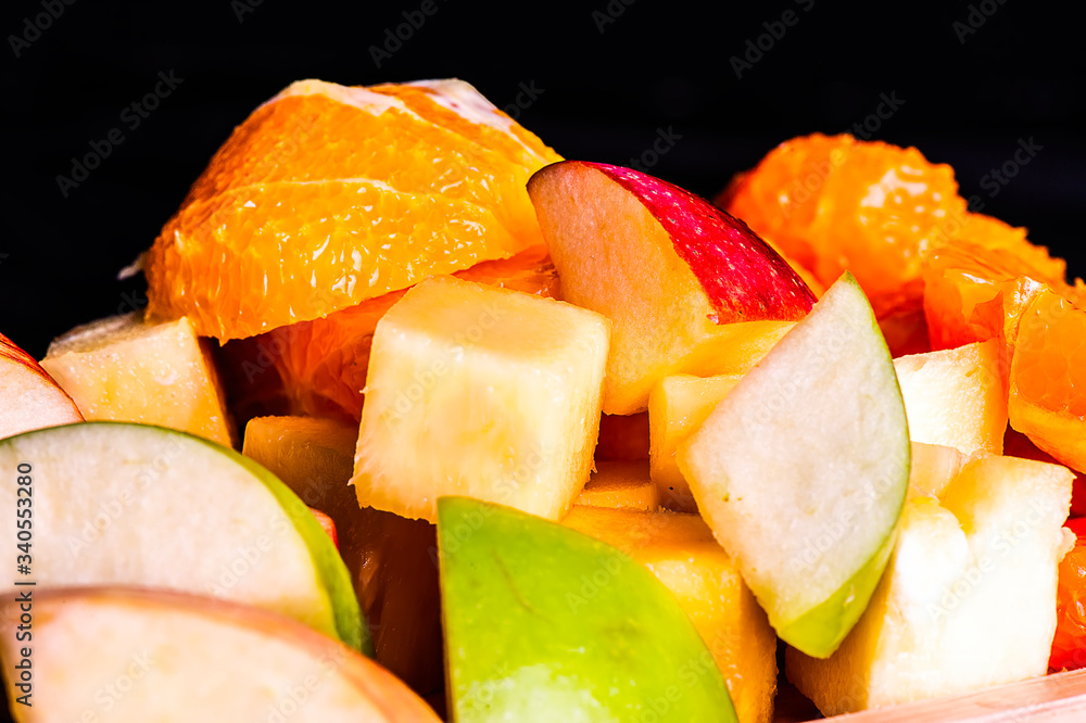 Many fruits are placed in a wooden tray. Many fruits are placed in a wooden tray.