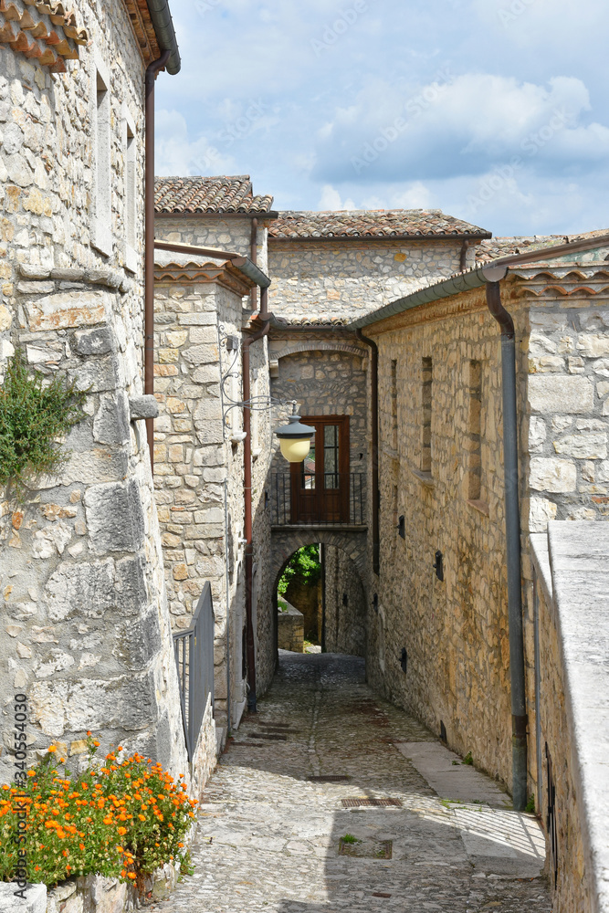 A narrow street between the old houses of Gesualdo, a village in the province of Avellino