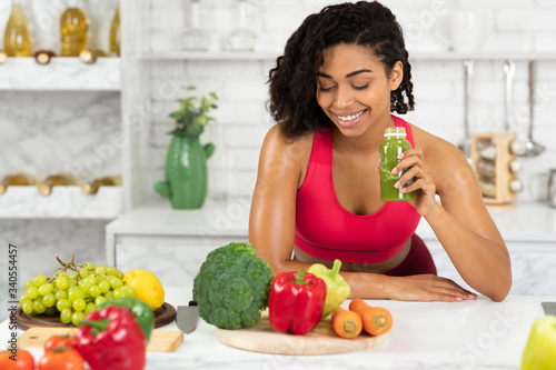 Fit Black Girl Drinking Delicious Green Detox Smoothie