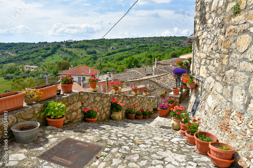 A narrow street between the old houses of Gesualdo, a village in the province of Avellino photo