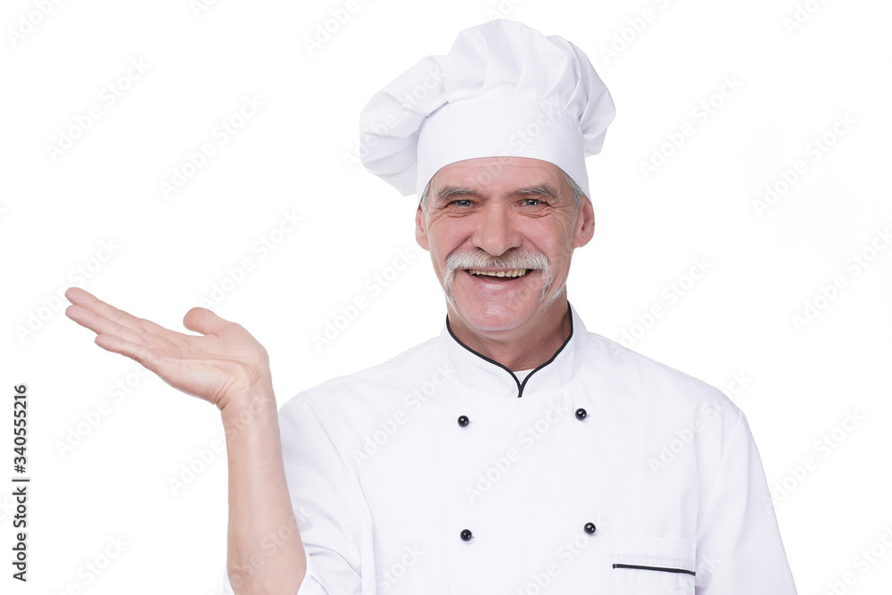 Old chef cook isolated on white background, holding hand, place for some text Old chef cook isolated on white background, holding hand, place for some text