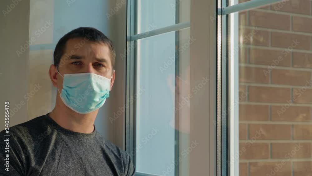 Man shows a lattice gesture with his fingers. Lattice gesture symbolizes the imprisonment of the house. Prevention COVID-19, concept home quarantine. Forced Home Isolation. Coronavirus self-isolation.