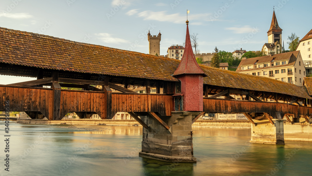 Historic old bridge (Spreuerbrücke) with tower over the river reuss, Lucerne Switzerland - Travel concept.