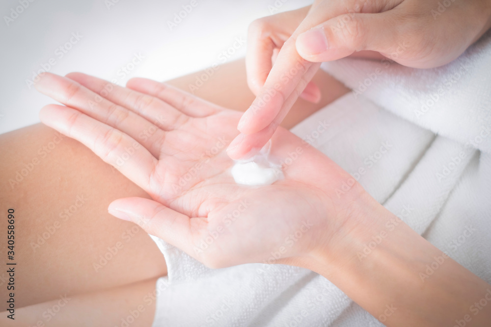 Woman applying moisturizing cream/lotion on hands, beauty concept.. Woman applying moisturizing cream/lotion on hands, beauty concept..