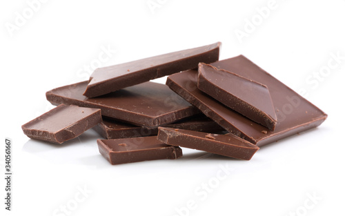 Bunch of chocolate pieces on white background. Isolated