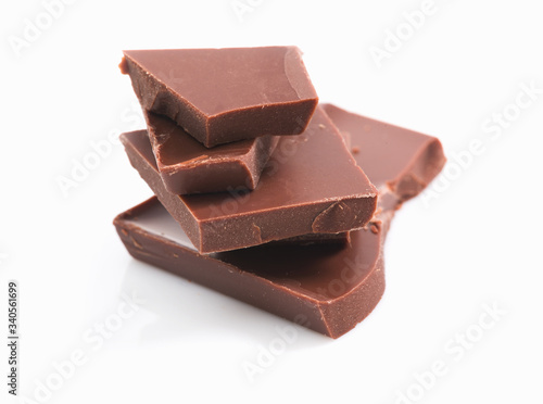 bath of chocolate pieces on white background. Isolated