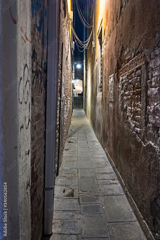 Narrow street of Venice in a mysterious night