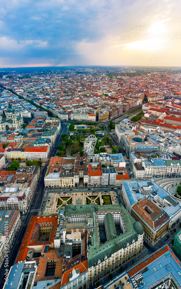 Fototapeta premium Europe hungary Budapest. Aerial panoramic cityscape about Budapest with epic sky. A Storm is comming on the background. Famous historical downtown in the foreground with ferris wheel.