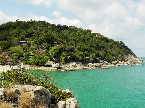 Beautiful coast with azure water cliffs and green jungle on Koh Phangan. Thailand. photo