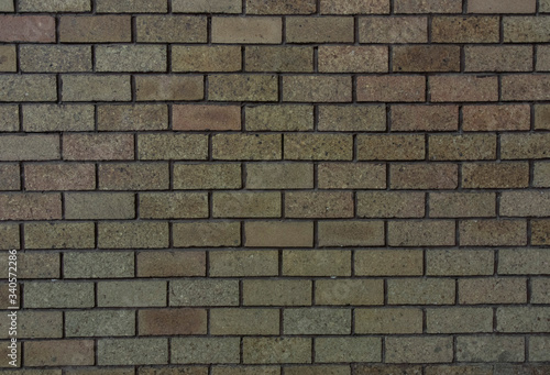 bricks red and broen color arranged in rows on wall