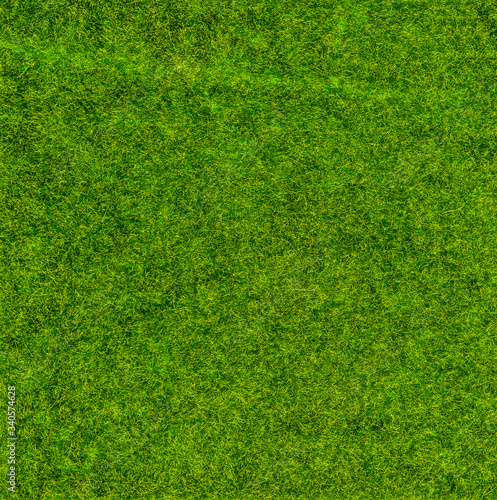 Close-up green artificial grass for texture and background.