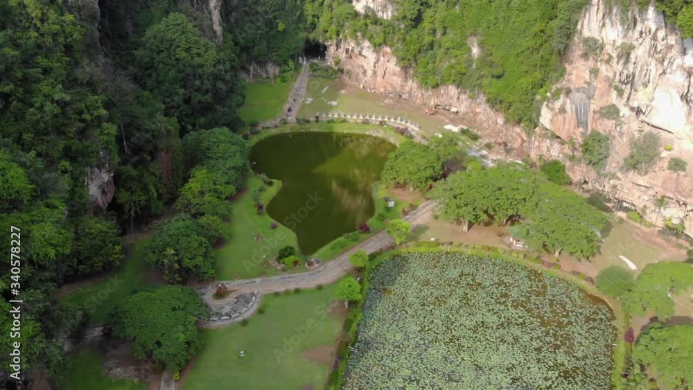 Top view of the Kek Look Tong Cave Temple surroundings - Dolly Backwards Top view of the Kek Look Tong Cave Temple surroundings - Dolly Backwards
