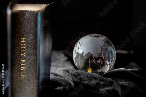 Black Holy Bible with Earth photo