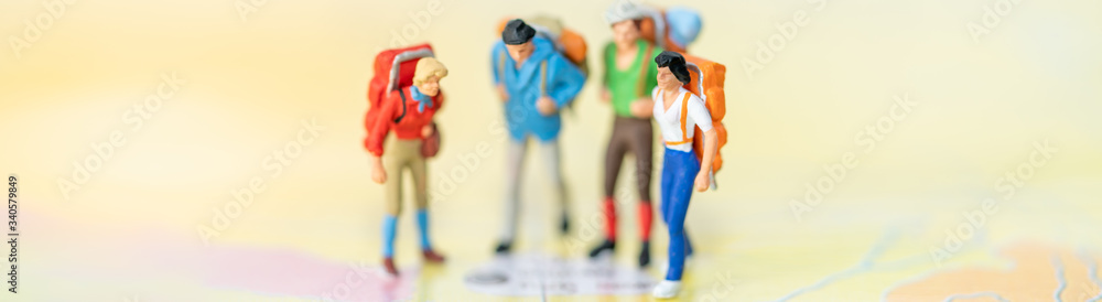 Miniature people: Group of backpacker on vintage world map using as ...