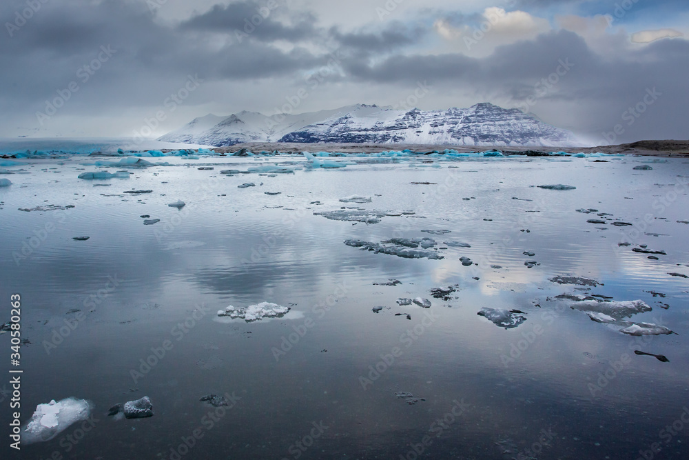 Jokulsarlon lagoon landscape showing a mountain reflected into the water, Iceland Jokulsarlon lagoon landscape showing a mountain reflected into the water, Iceland