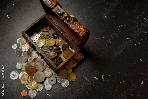 old coins collection in wooden chest box