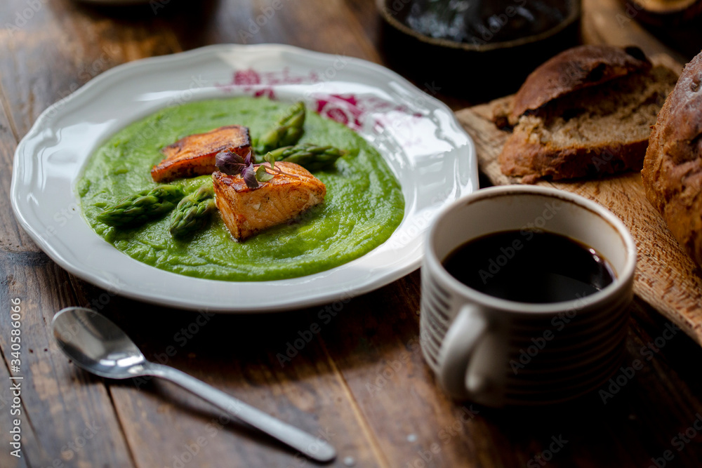 healthy breakfast: asparagus sauce, fried salmon, bread and coffee