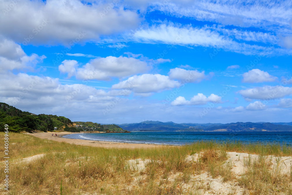 Kuaotunu Beach on the Coromandel Peninsula, New Zealand, on a beautiful summer day Kuaotunu Beach on the Coromandel Peninsula, New Zealand, on a beautiful summer day