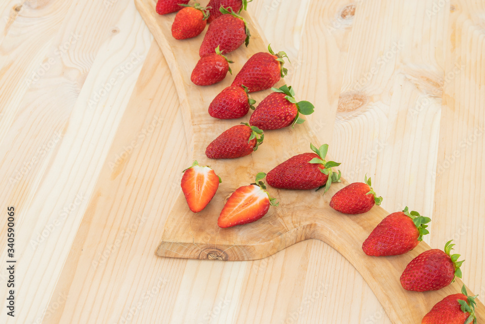 red fresh strawberries on wooden table