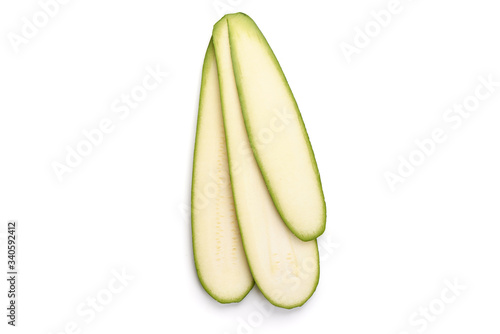Zucchini slices, isolated on white background