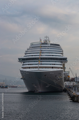 Large white cruise ship in the port of Savona, Italy