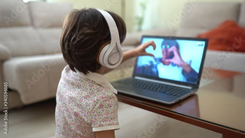 Girl talking by videoconference to her mother, who is isolated by Covid-19 photo