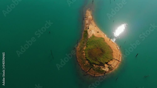 Aerial View Of A Lush Green Islets  Surrounded By The Calm Blue Lake In Thailand - Aerial Shot photo