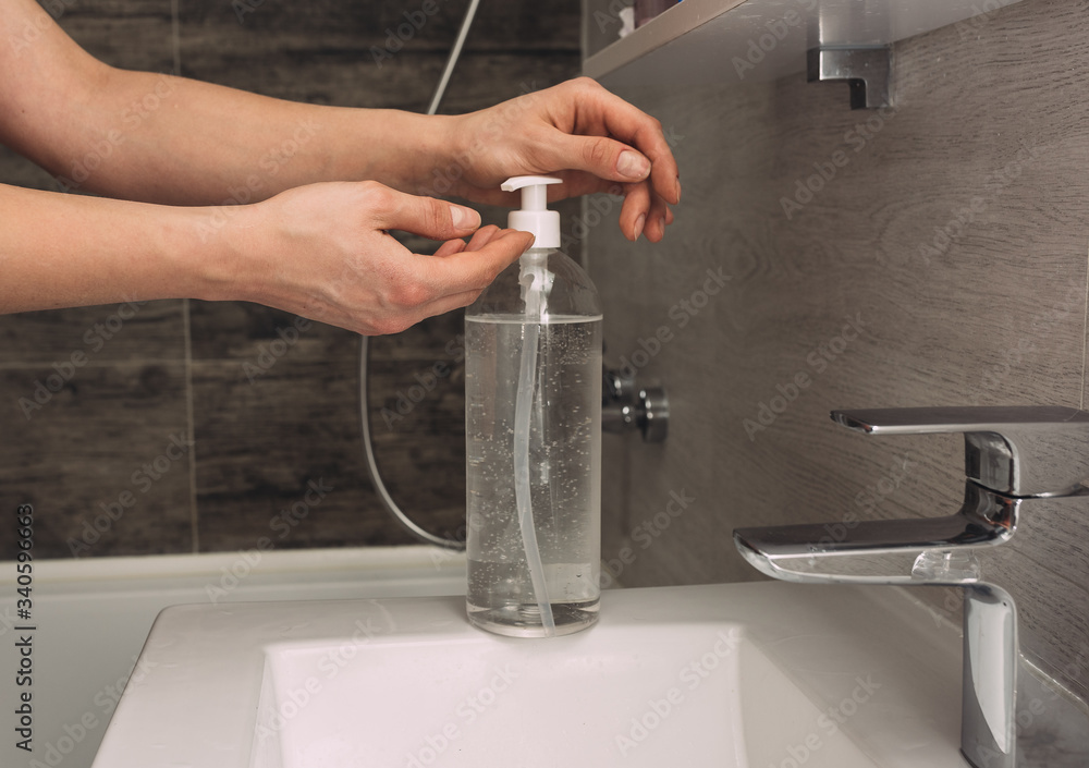 use alcohol gel cleanse wash hand sanitizer antiviral bacteria dirty skin care, photo in the bathroom on the sink use alcohol gel cleanse wash hand sanitizer antiviral bacteria dirty skin care, photo in the bathroom on the sink